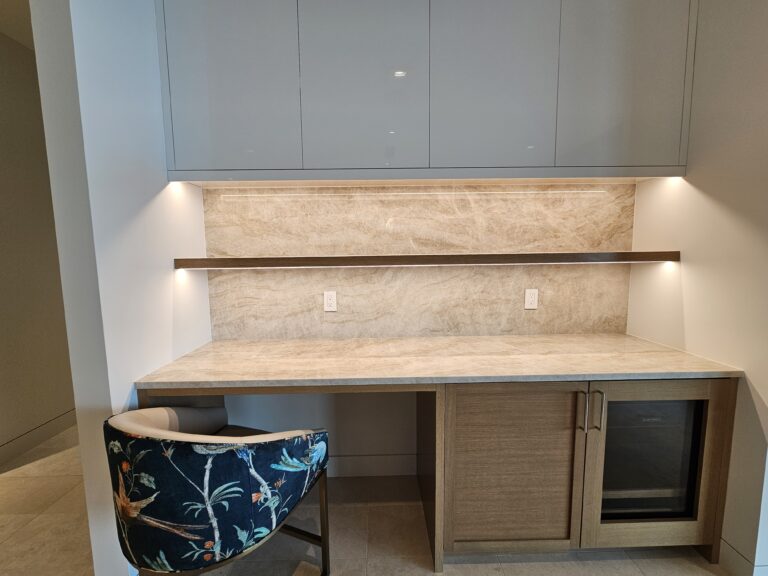 Built-in buffet nook with quartzite counter and backsplash, floating wood shelf, and beverage cooler