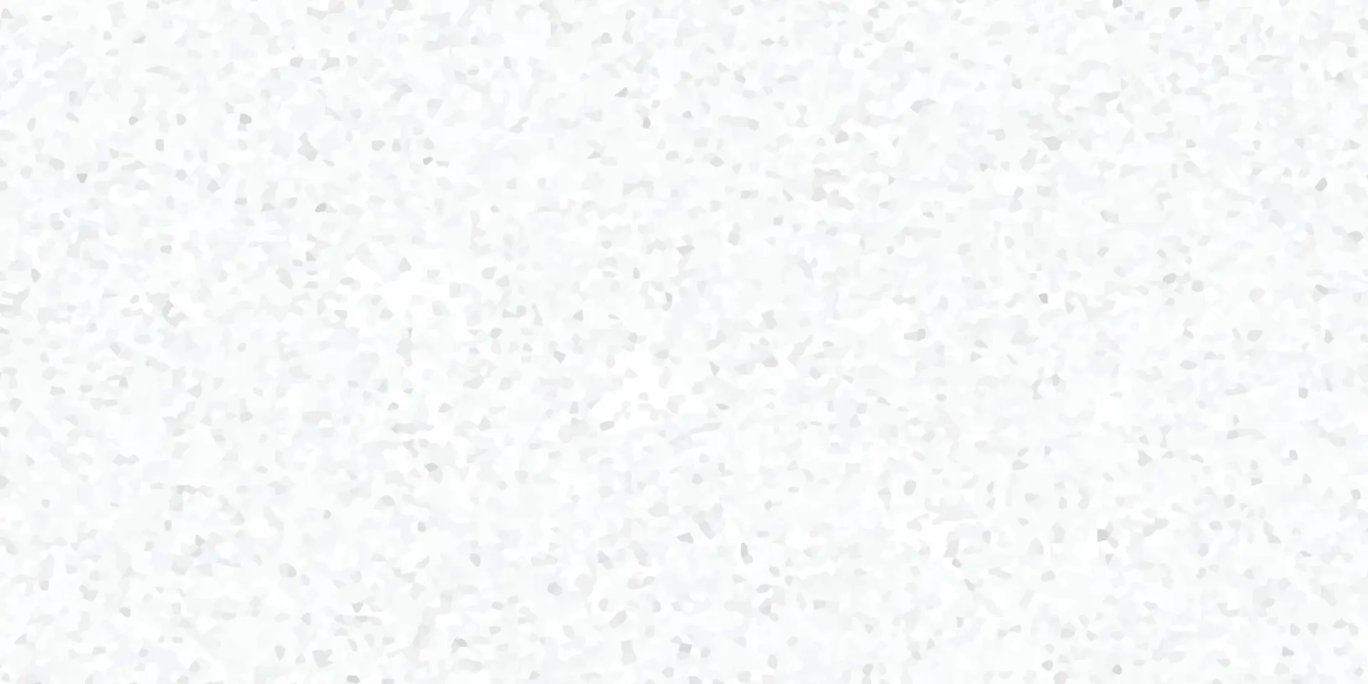 White quartz surface with fine gray speckles, close-up texture